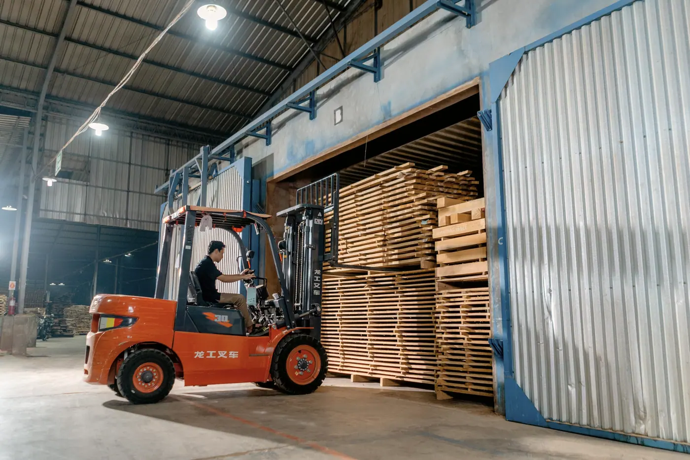 Forklift moving stock inside a distribution warehouse