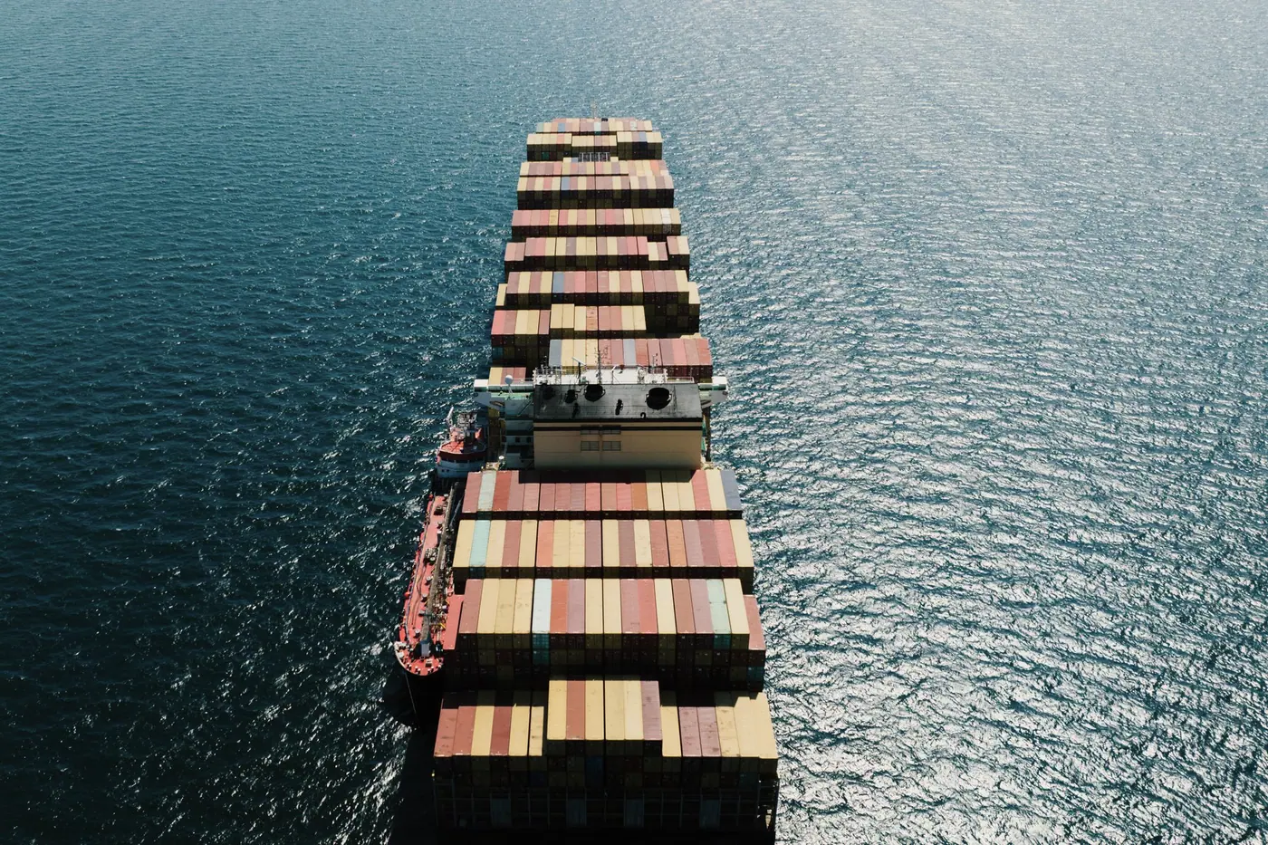Loaded container vessel under way, seen from above the bow