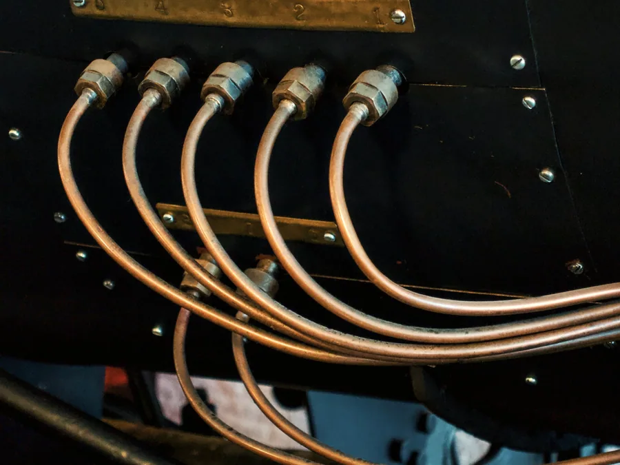 Formed metal tube runs on an equipment assembly
