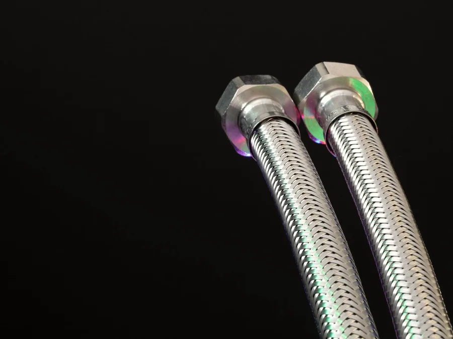 Pair of braided steel flexible hose assemblies with hex swivel nuts
