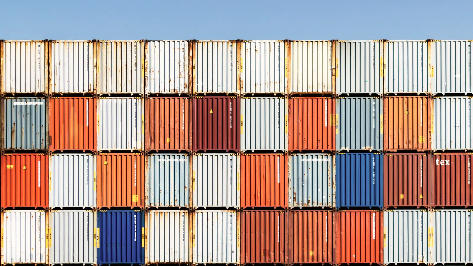 Freight containers stacked in a terminal yard