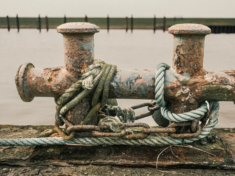 Mooring bollards with heavy rope made fast on a quayside