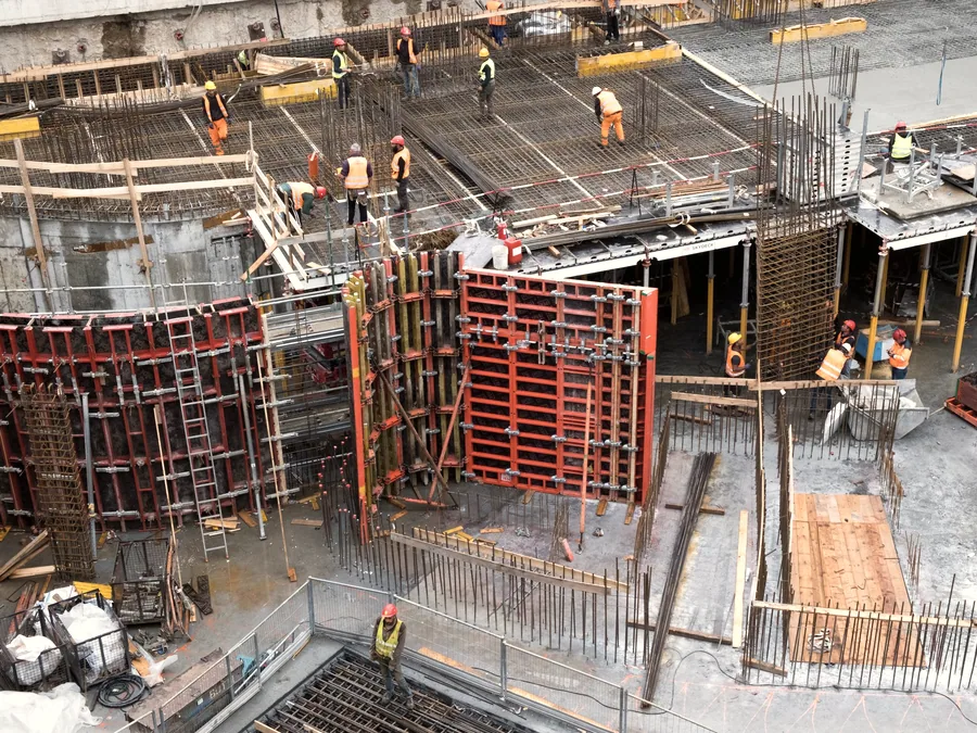 Site crew in high visibility clothing working on an industrial construction site