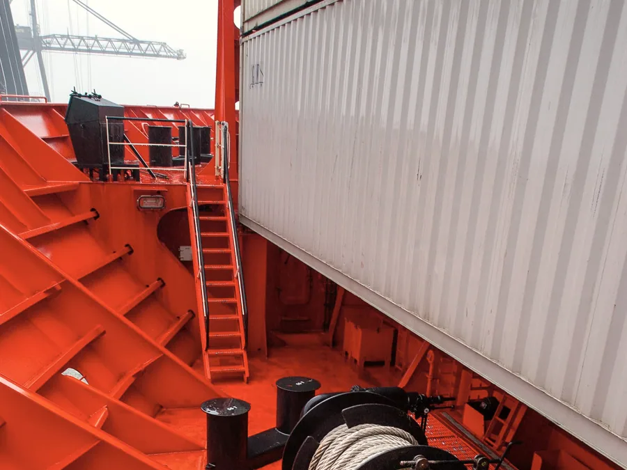 Hydraulic mooring winch drums on a ship deck