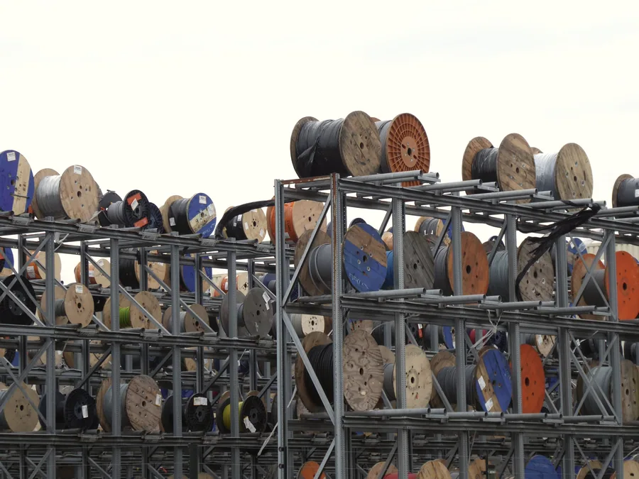 Cable drums racked in a supplier yard