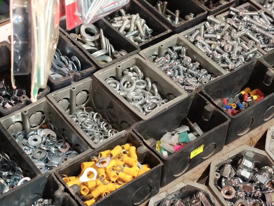 Fasteners sorted into parts bins at a supply counter