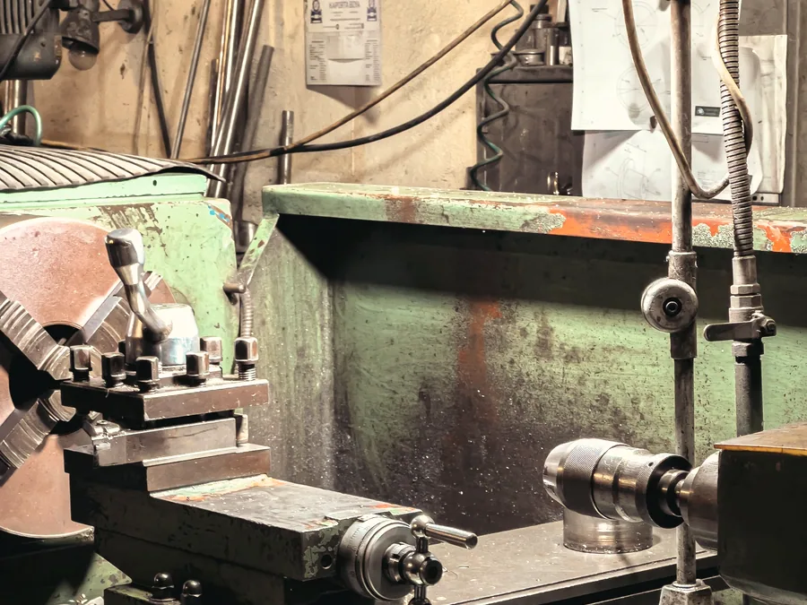 Component set up on a lathe for machining in a workshop