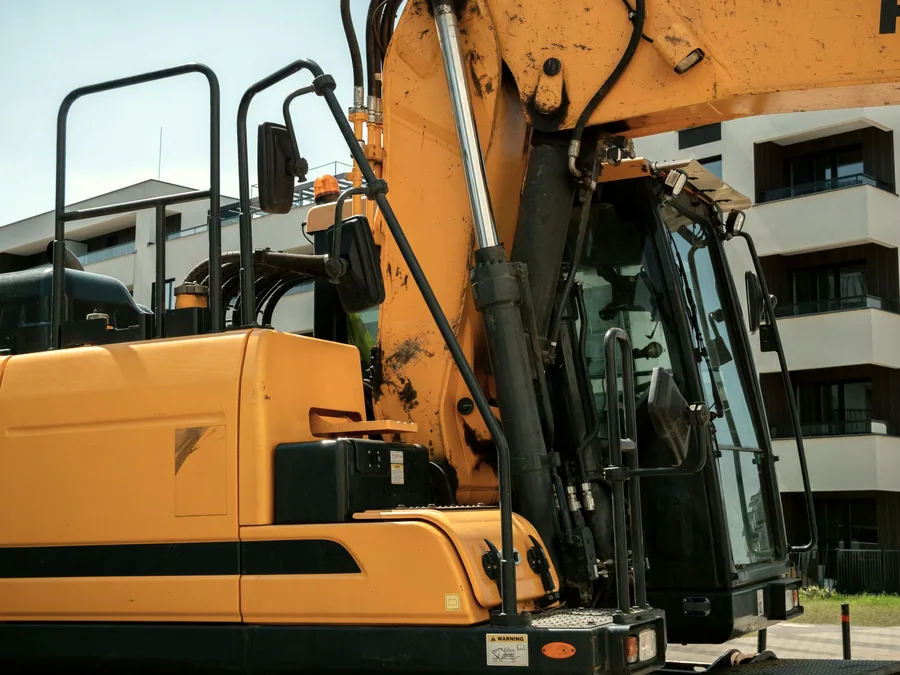 Hydraulic cylinders and rams on excavator boom and arm