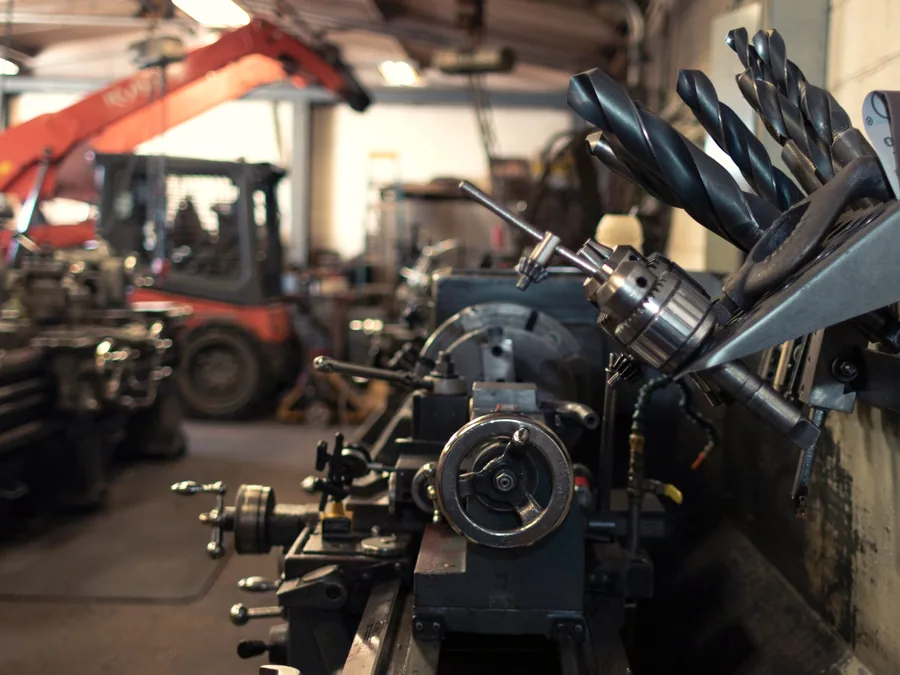 Machine tooling and cutting tools set out in a workshop