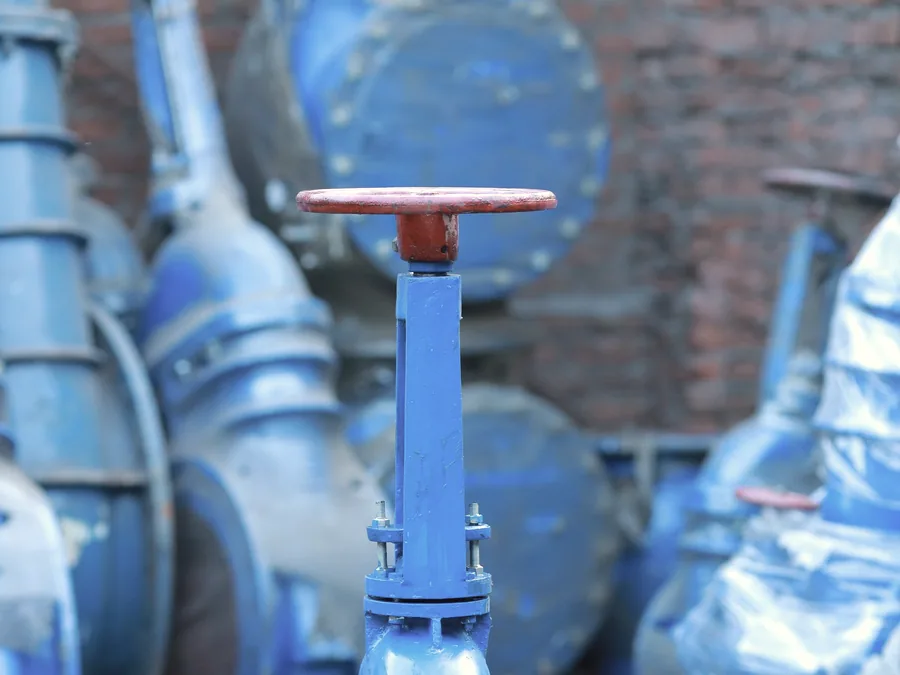 Flanged industrial gate valves stacked ready for despatch